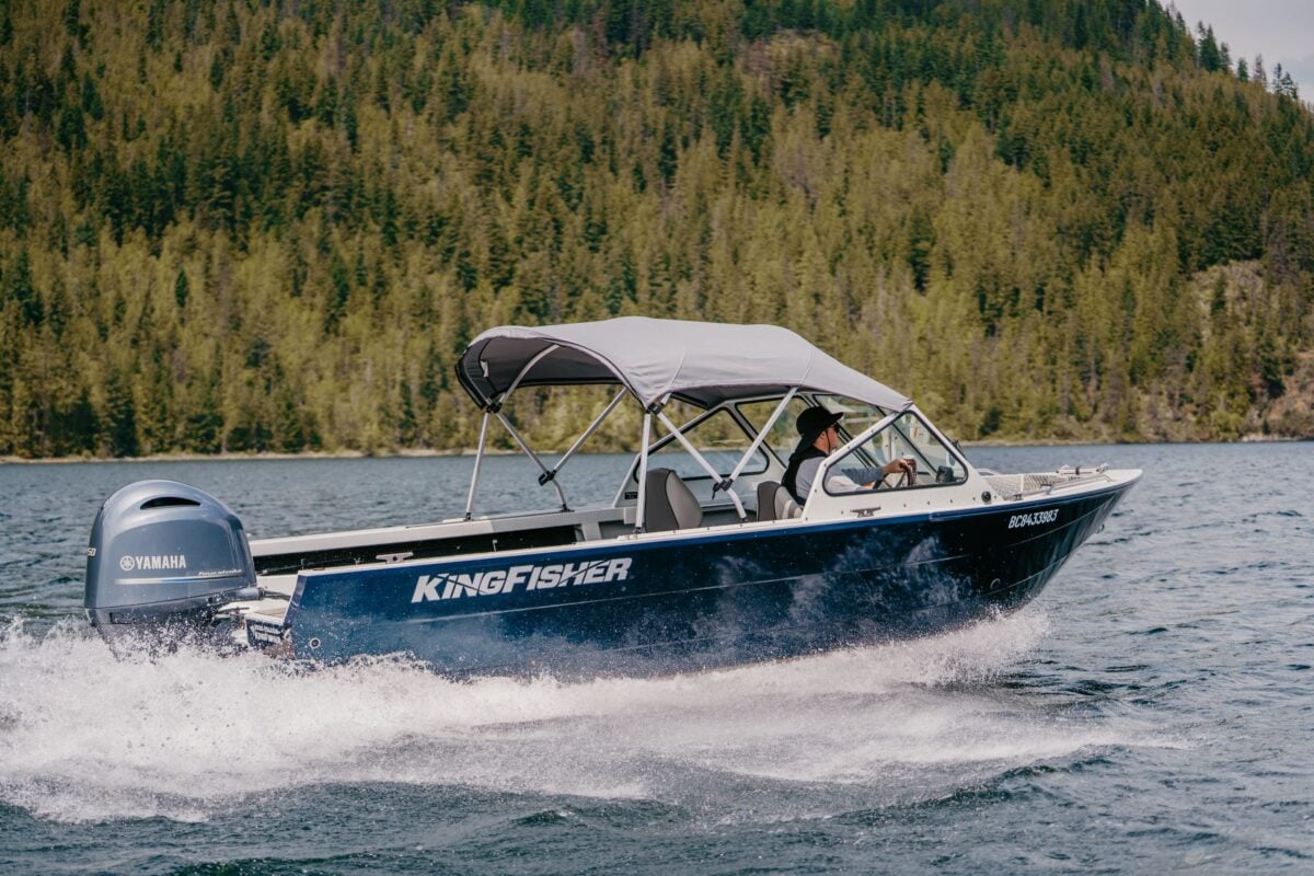 KingFisher 2025 Falcon with canvas top running at speed on BC mountain lake