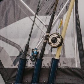KingFisher 16 Falcon rod storage with multiple fishing rods and canvas enclosure